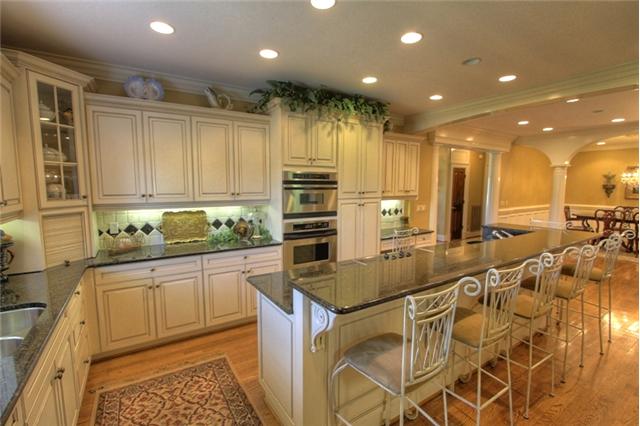 3334 Armstrong Valley Road Murfreesboro, TN 37128 - Photo 7 of 19 a kitchen with kitchen island granite countertop a sink and counter space