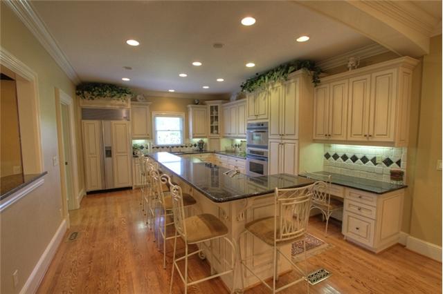 3334 Armstrong Valley Road Murfreesboro, TN 37128 - Photo 8 of 19 a kitchen with stainless steel appliances kitchen island granite countertop a refrigerator and a stove top oven