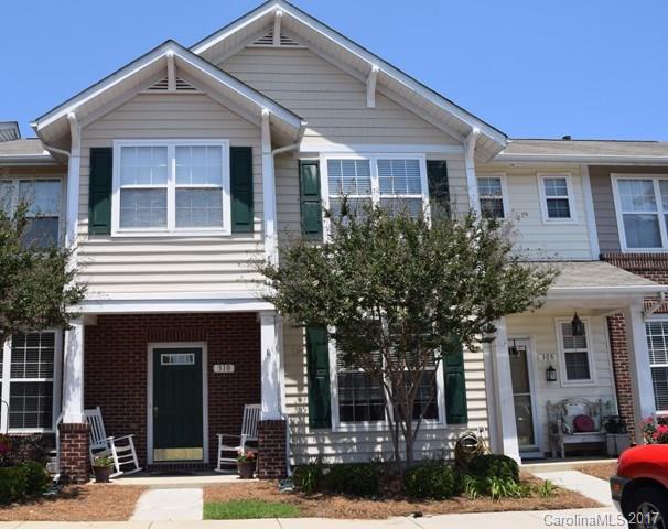 310 Tinder Box Lane, Unit 310 Fort Mill, SC 29708 - Photo 1 of 19 a front view of a house with garden