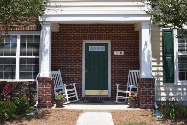 310 Tinder Box Lane, Unit 310 Fort Mill, SC 29708 - Photo 2 of 19 a front view of a house with a yard
