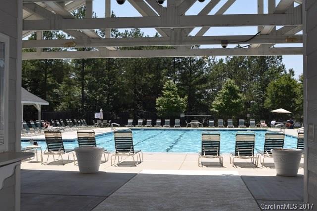 310 Tinder Box Lane, Unit 310 Fort Mill, SC 29708 - Photo 17 of 19 a view of a patio with table and chairs potted plants and large tree