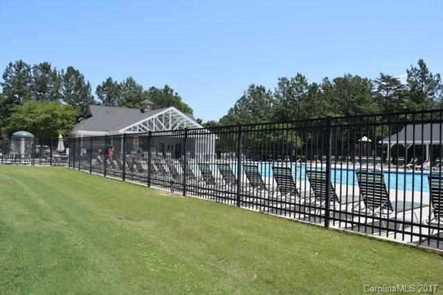 310 Tinder Box Lane, Unit 310 Fort Mill, SC 29708 - Photo 18 of 19 a front view of a house with a garden