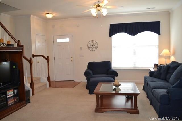 310 Tinder Box Lane, Unit 310 Fort Mill, SC 29708 - Photo 3 of 19 a living room with furniture and a flat screen tv