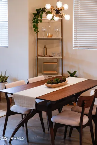 a dining room with a table and chairs