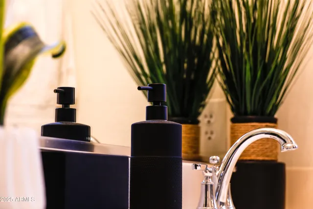 a close up of a pot on the wall and glass door