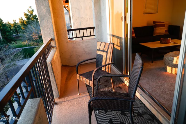 a view of balcony with wooden floor and outdoor seating