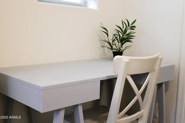 a utility room with two washing machine and stairs