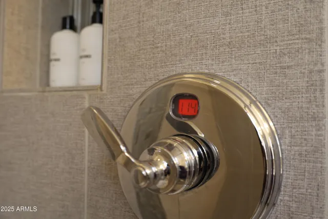 a room with a potted plant on a stool