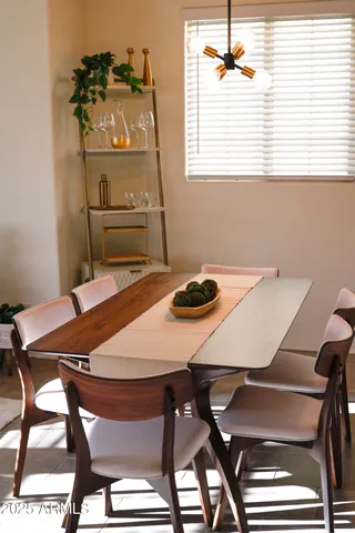 a view of a dining room with furniture and a window