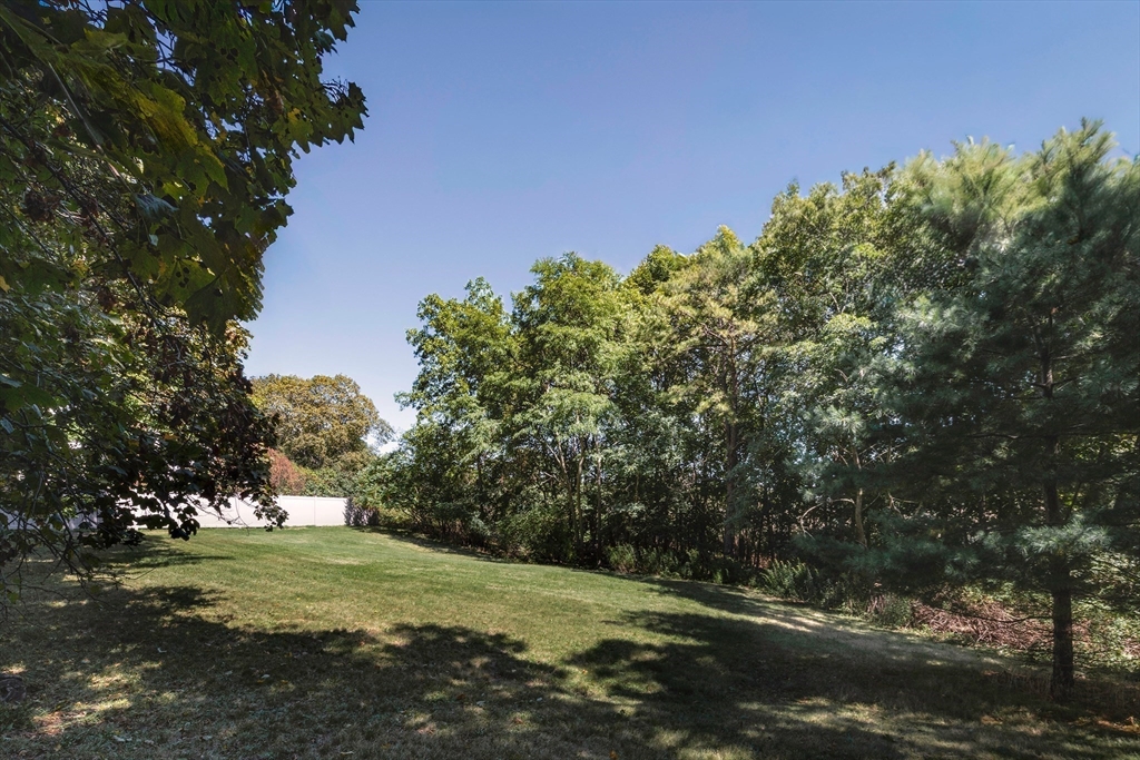 23 Jeffrey's Neck Road Ipswich, MA 01938 - Photo 8 of 12 a view of a field with an trees