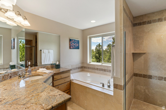 755 South Zion Ridge Drive Orderville, UT 84758 - Photo 71 of 84 Full bathroom featuring a garden tub, a stall shower, and vanity