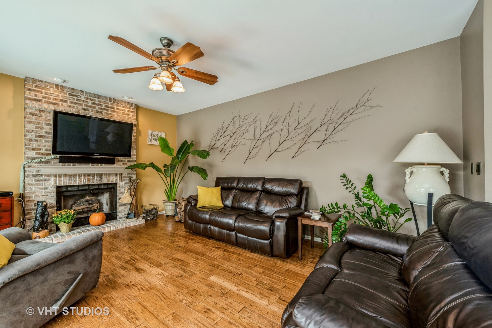 Undisclosed Address Algonquin, IL 60102 - Photo 11 of 40 a living room with furniture a fireplace and a flat screen tv