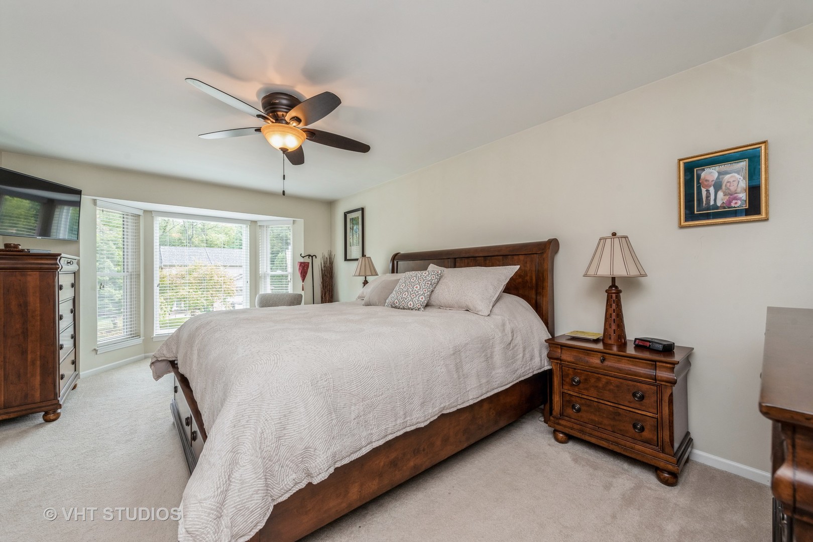 Undisclosed Address Algonquin, IL 60102 - Photo 14 of 40 a bedroom with a bed and a chandelier