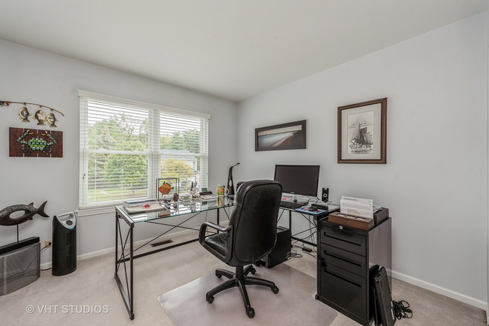 Undisclosed Address Algonquin, IL 60102 - Photo 17 of 40 a view of a workspace with furniture and a window