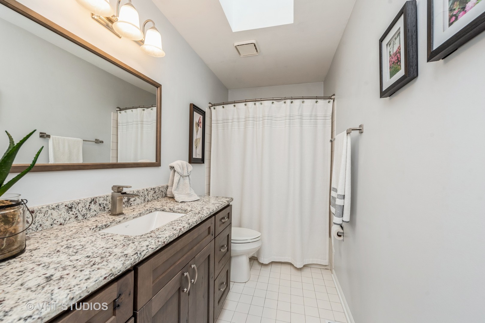 Undisclosed Address Algonquin, IL 60102 - Photo 20 of 40 a bathroom with a granite countertop sink a toilet and a mirror
