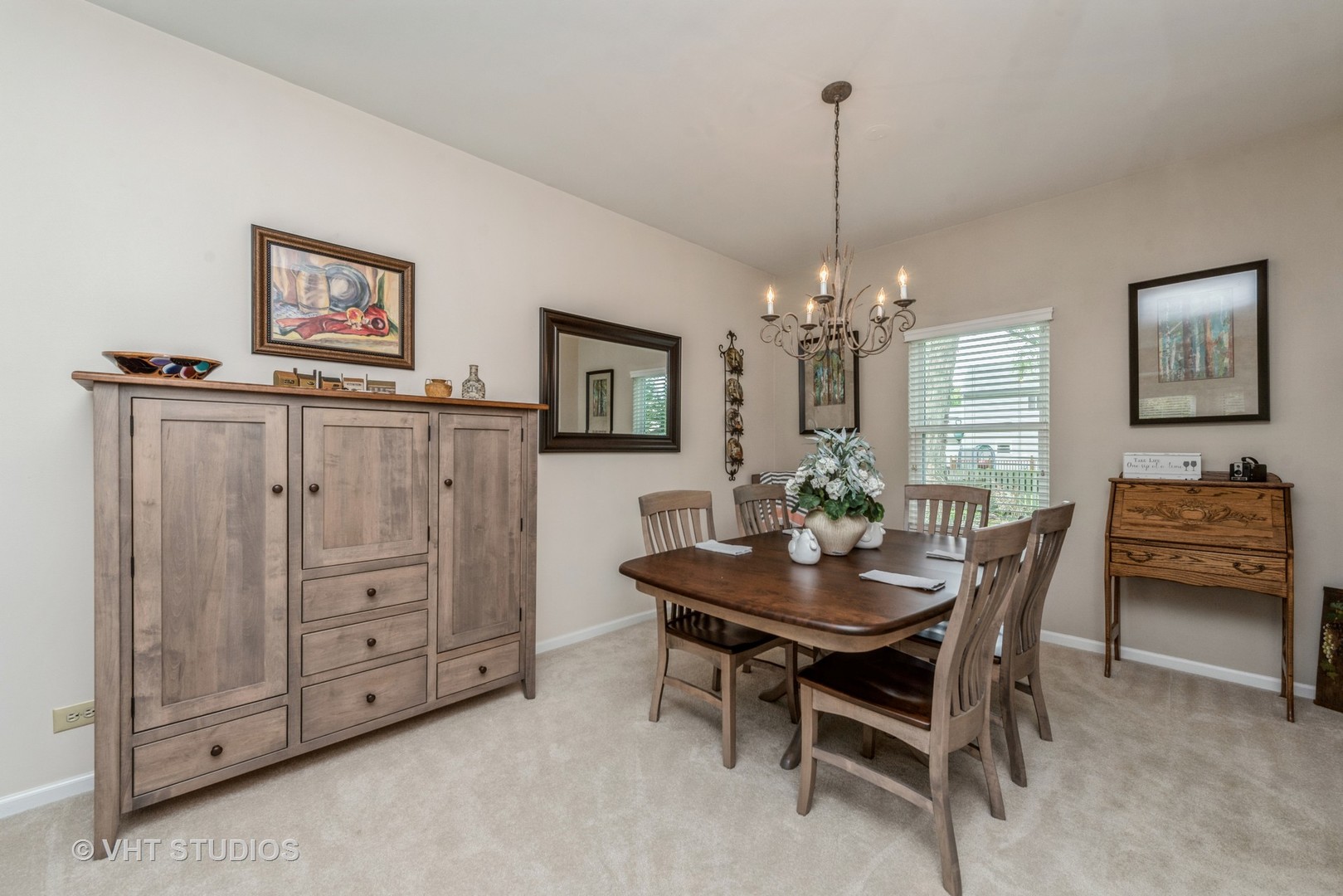 Undisclosed Address Algonquin, IL 60102 - Photo 7 of 40 a view of a dining room with furniture and chandelier