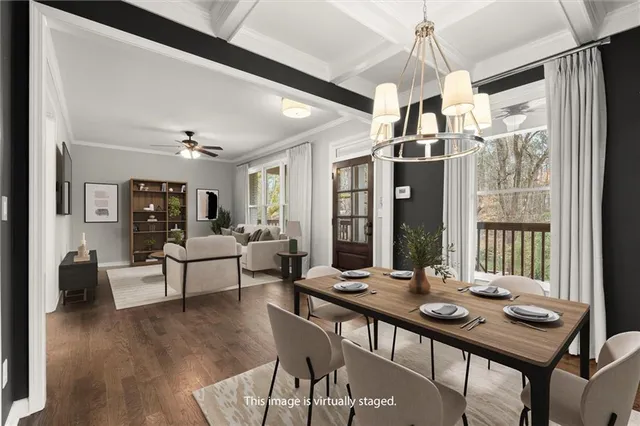 a view of a dining room with furniture window and wooden floor