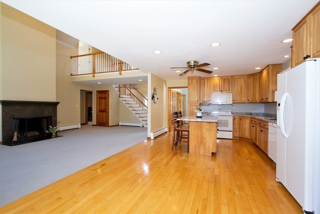 22 Edgemere Road North Reading, MA 01864 - Photo 11 of 42 a view of kitchen with furniture and wooden floor