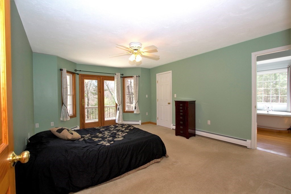 22 Edgemere Road North Reading, MA 01864 - Photo 15 of 42 a bedroom with a bed and a window