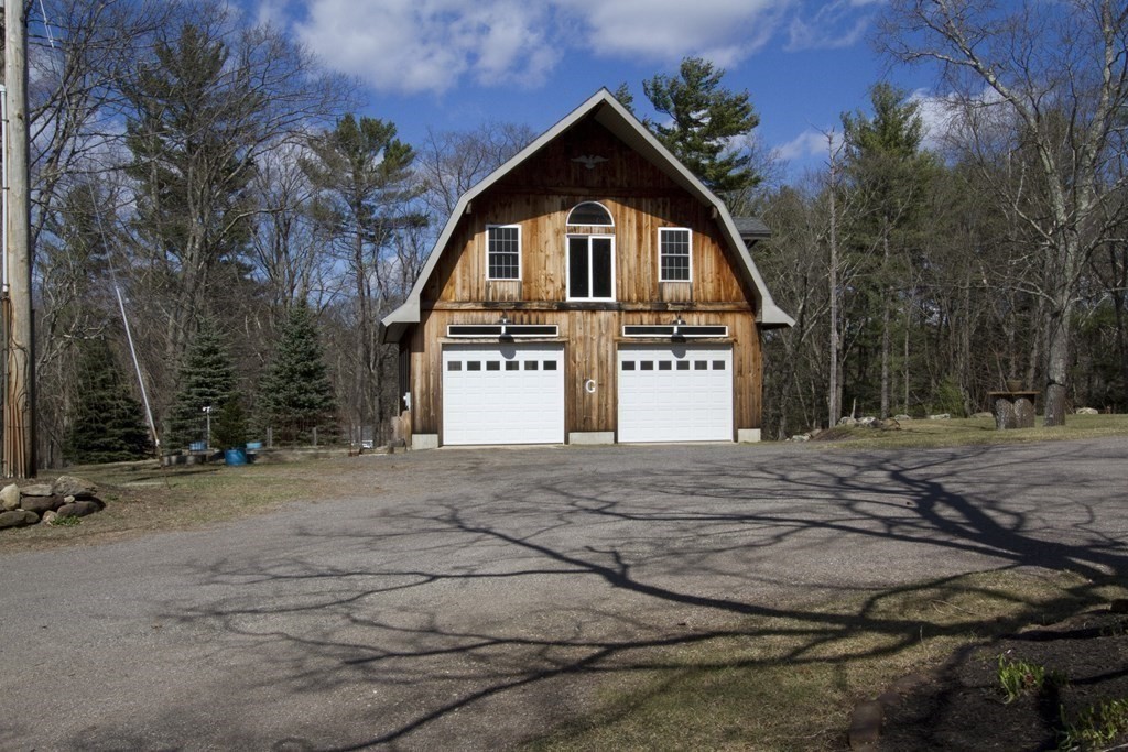 22 Edgemere Road North Reading, MA 01864 - Photo 34 of 42 a front view of a house with a yard