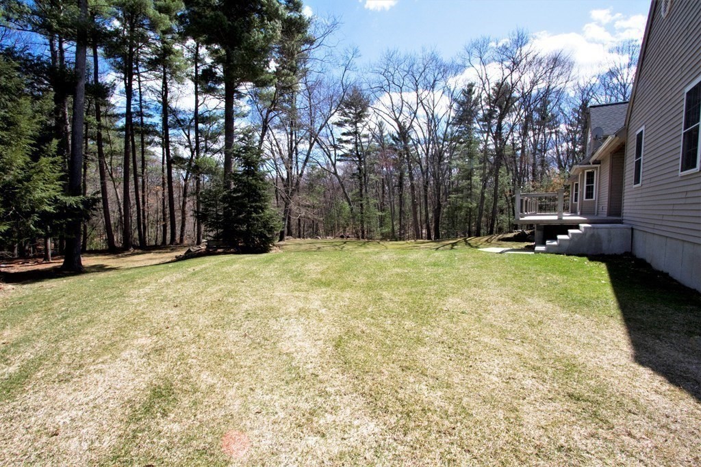 22 Edgemere Road North Reading, MA 01864 - Photo 40 of 42 a swimming pool with outdoor seating and yard