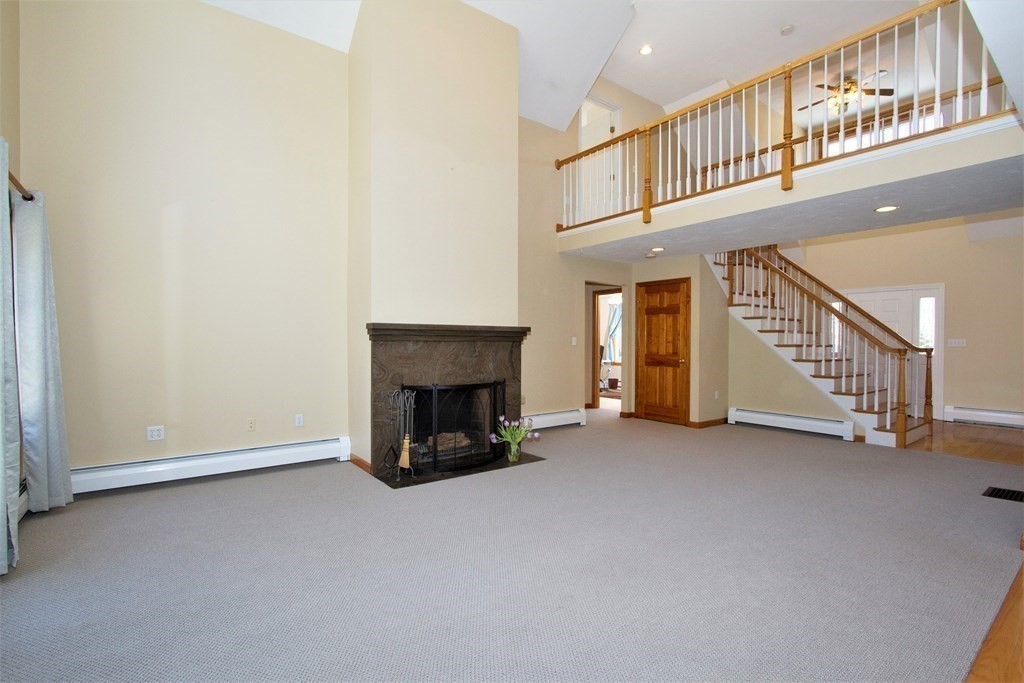 22 Edgemere Road North Reading, MA 01864 - Photo 8 of 42 a view of an empty room with stairs