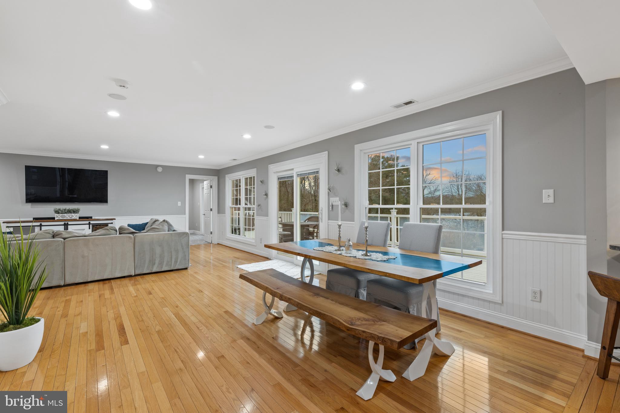 7800 Burgess Road Pasadena, MD 21122 - Photo 16 of 77 Dining area with sliders to the expansive deck