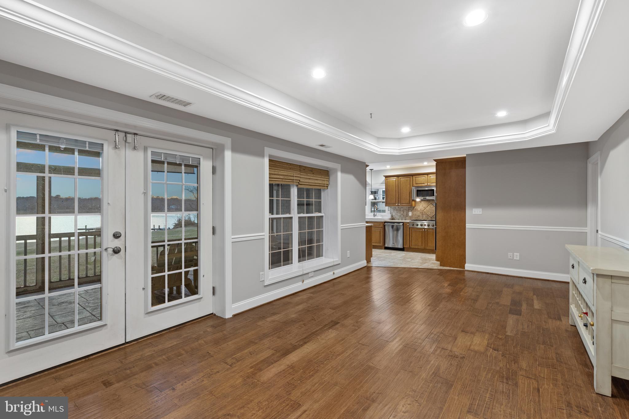 7800 Burgess Road Pasadena, MD 21122 - Photo 42 of 77 Walk-out level basement to large screen porch