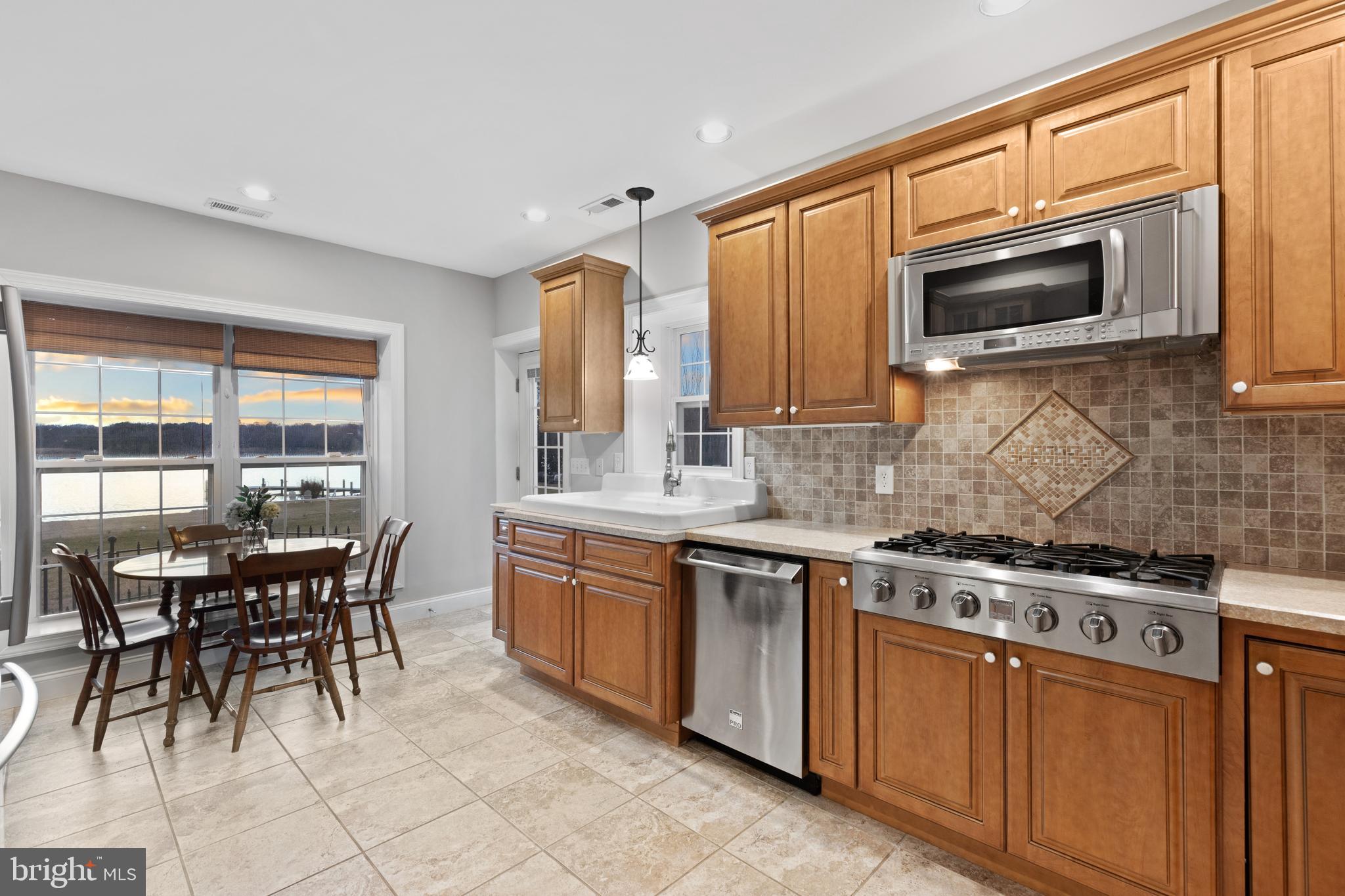 7800 Burgess Road Pasadena, MD 21122 - Photo 46 of 77 6 burner gas stove and high end SS appliances