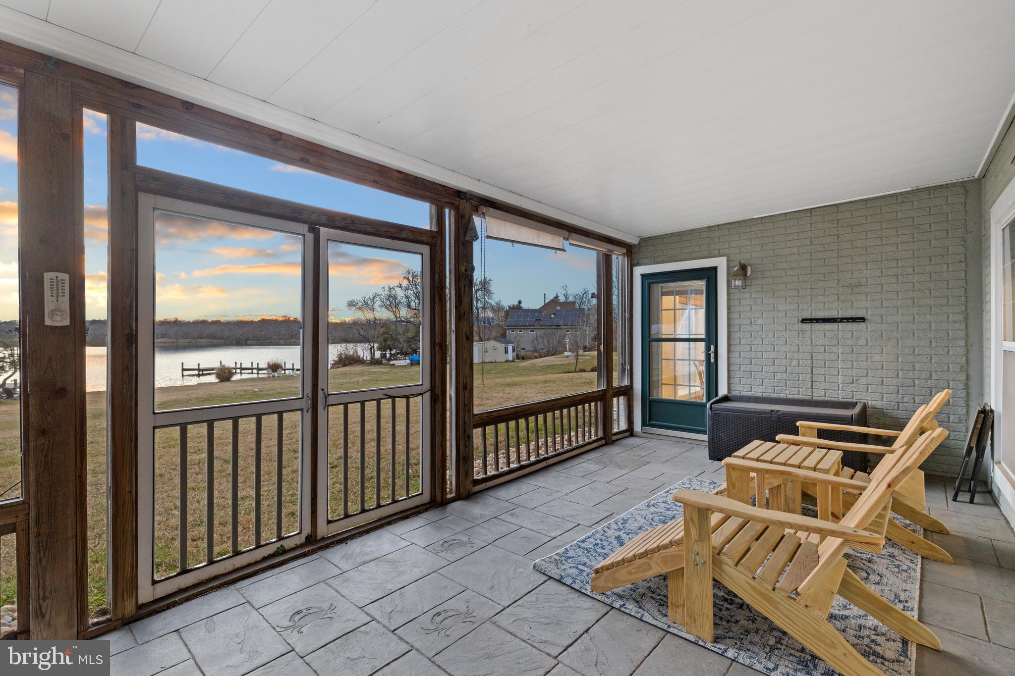 7800 Burgess Road Pasadena, MD 21122 - Photo 56 of 77 Large screen porch w/stampled concrete flooring