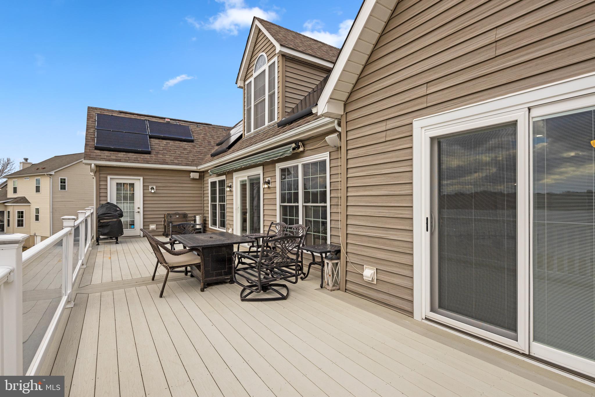 7800 Burgess Road Pasadena, MD 21122 - Photo 71 of 77 expansive trek decking w/retractable awning
