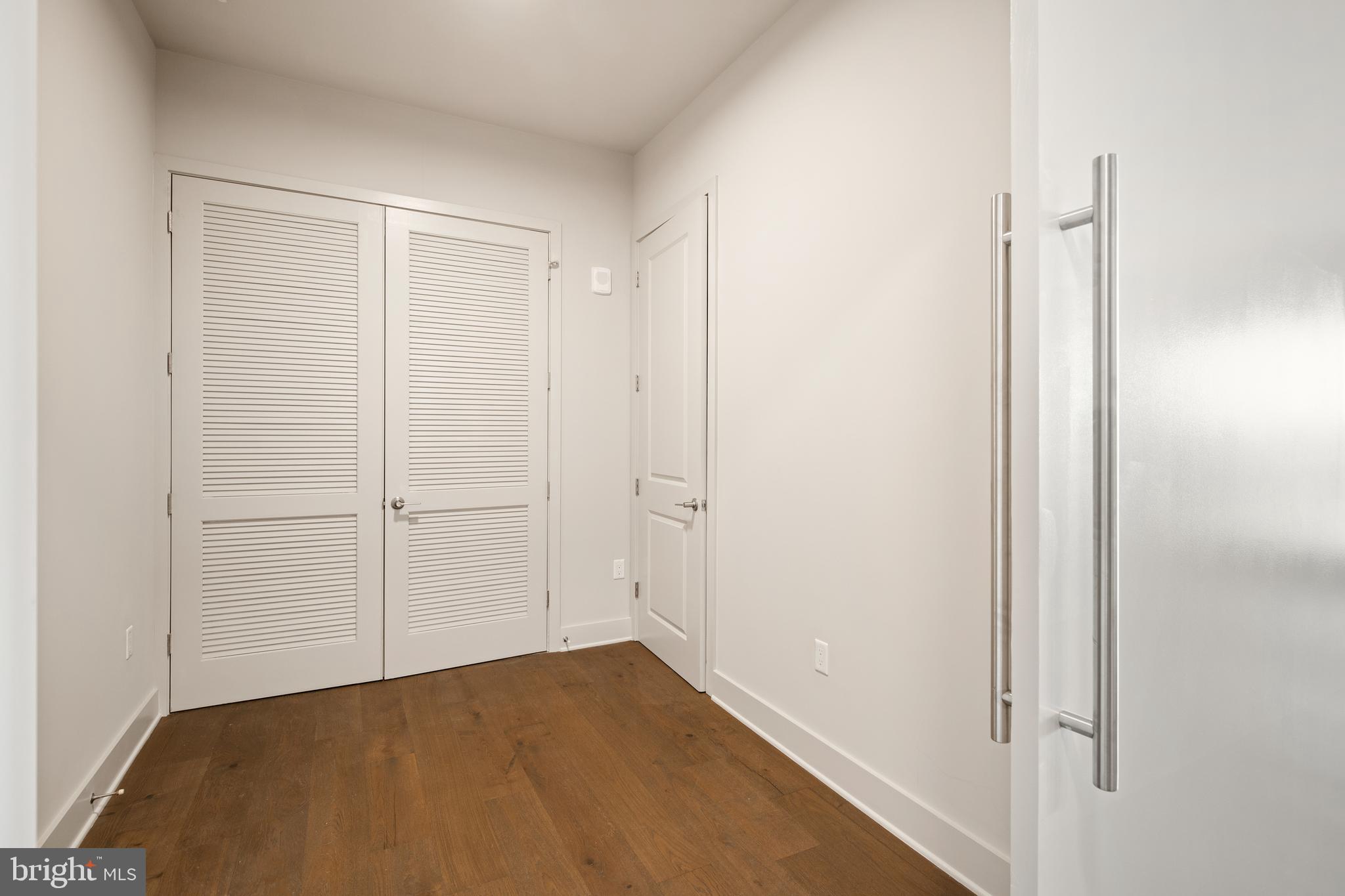 6803 Cameron Drive Northwest, Unit 406 Washington, DC 20012 - Photo 4 of 10 den w/ coat closet