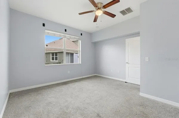a view of an empty room with a window