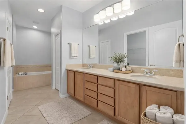 an empty room with a window and a ceiling fan