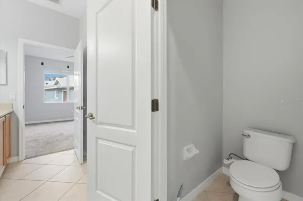 a bathroom with a sink toilet and vanity