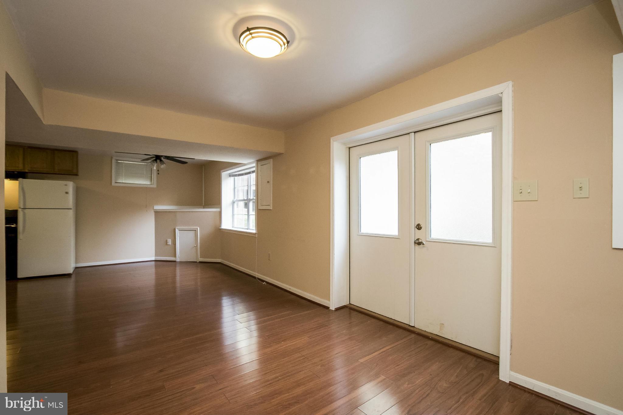 11706 Smithfield Road Manassas, VA 20112 - Photo 20 of 25 Basement Recreation Room with Laminate Hardwood!