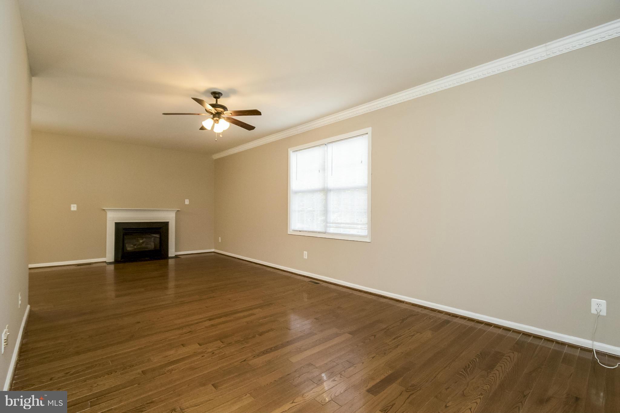 11706 Smithfield Road Manassas, VA 20112 - Photo 3 of 25 Family Room w/ Hardwood and Gas Fireplace!