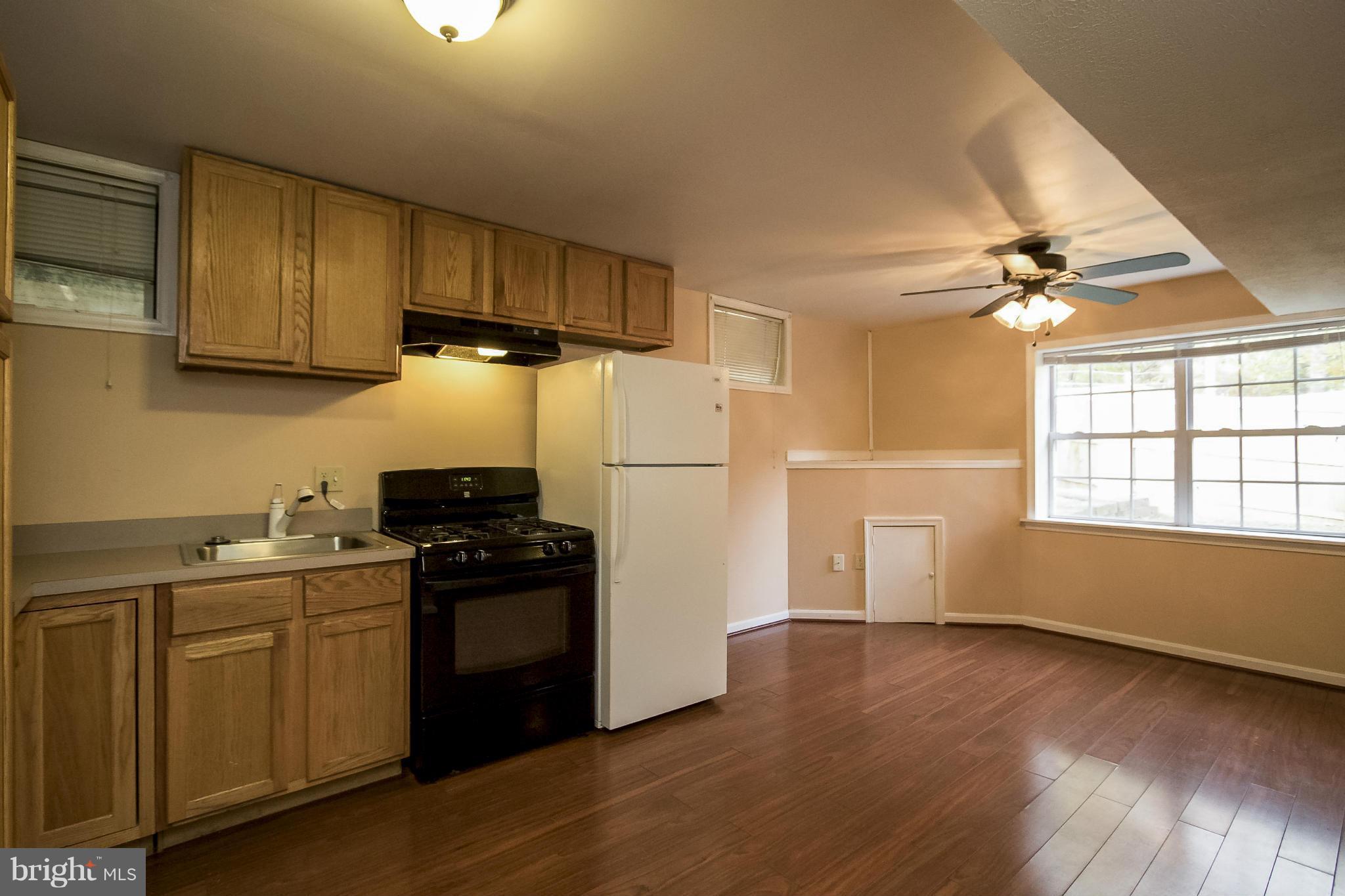 11706 Smithfield Road Manassas, VA 20112 - Photo 21 of 25 Basement Kitchen with Laminate Hardwood Flooring!