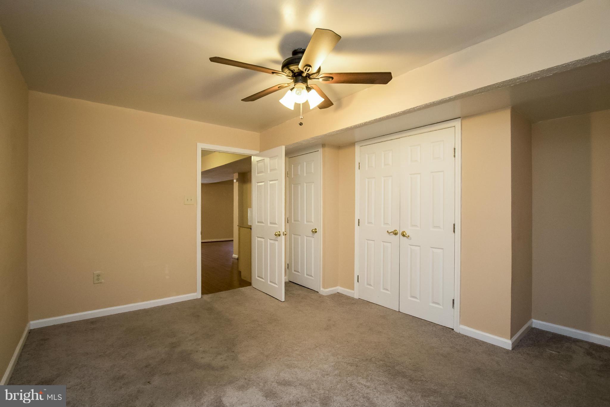 11706 Smithfield Road Manassas, VA 20112 - Photo 23 of 25 Basement Den loaded with Closets Space!