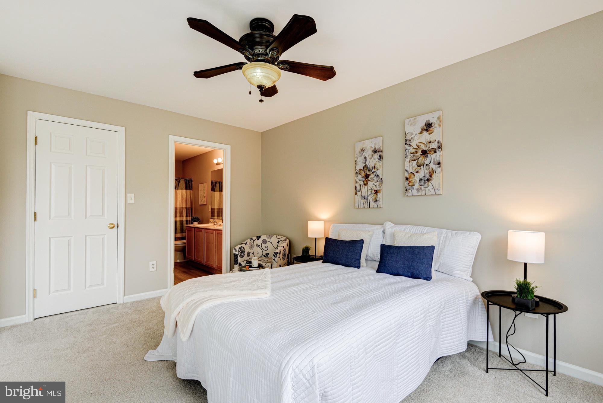 164 Springfield Circle Middletown, DE 19709 - Photo 22 of 49 a bedroom with a bed and a lamp on a dresser