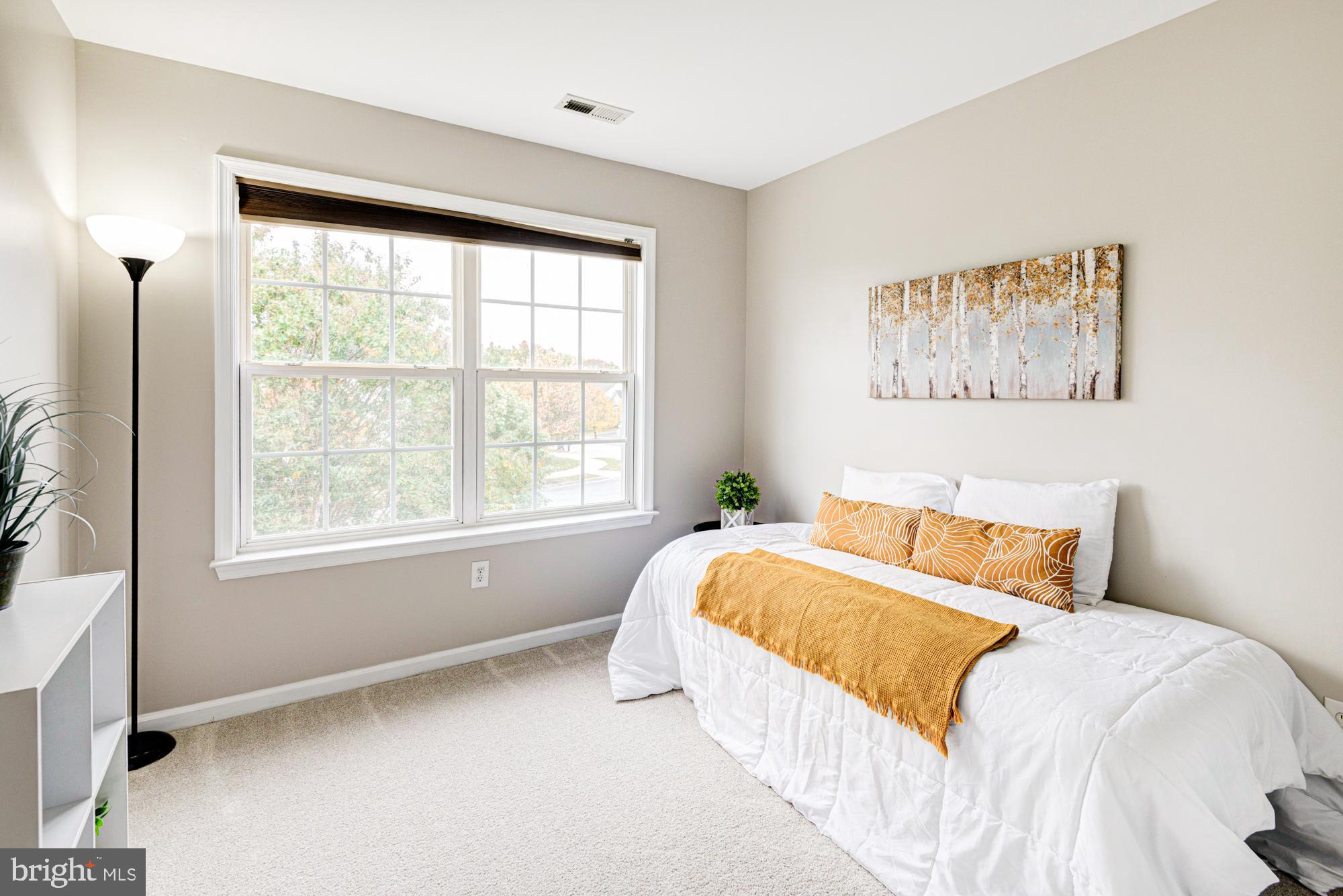 164 Springfield Circle Middletown, DE 19709 - Photo 28 of 49 a bedroom with a bed and a large window