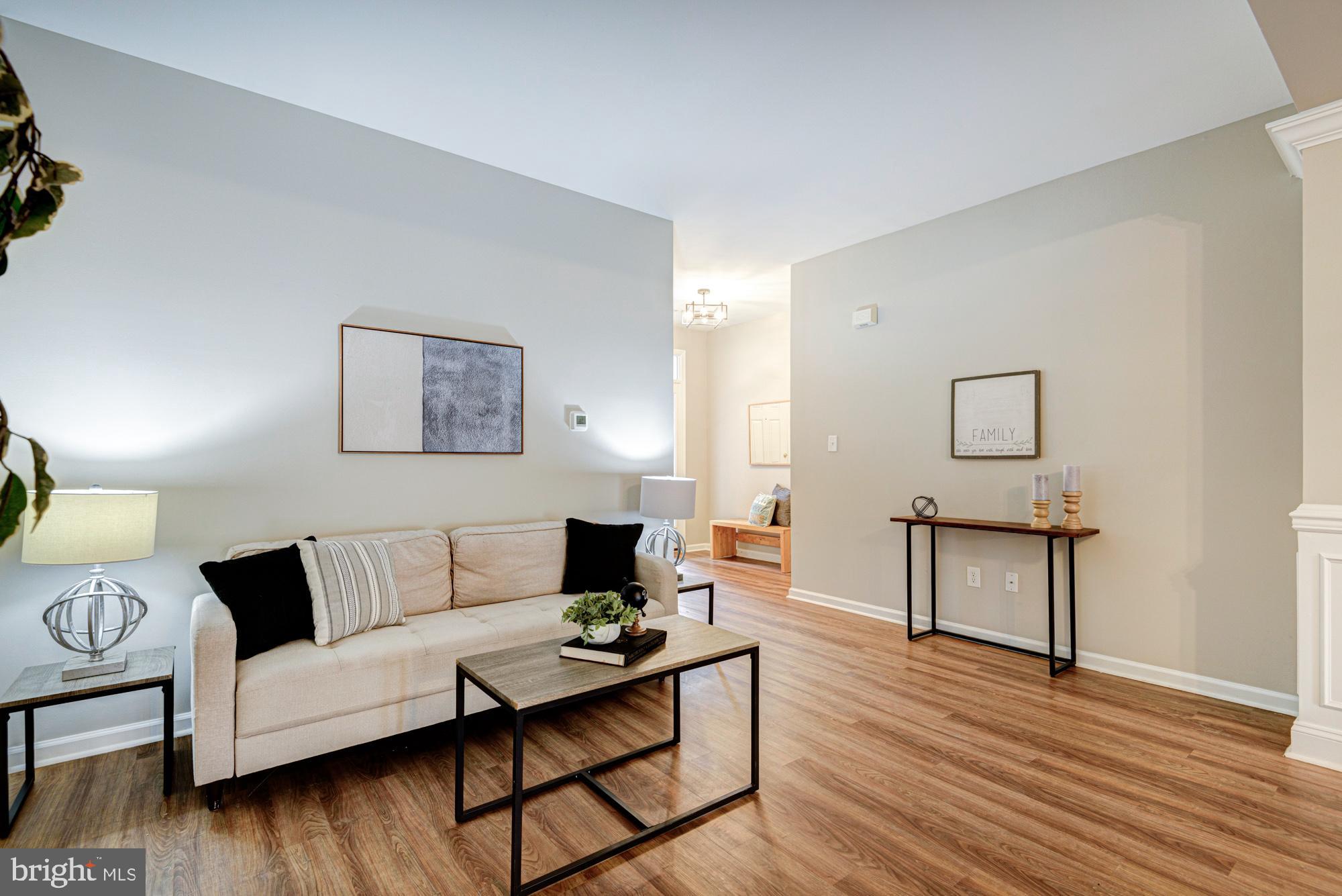 164 Springfield Circle Middletown, DE 19709 - Photo 8 of 49 a living room with furniture and a wooden floor