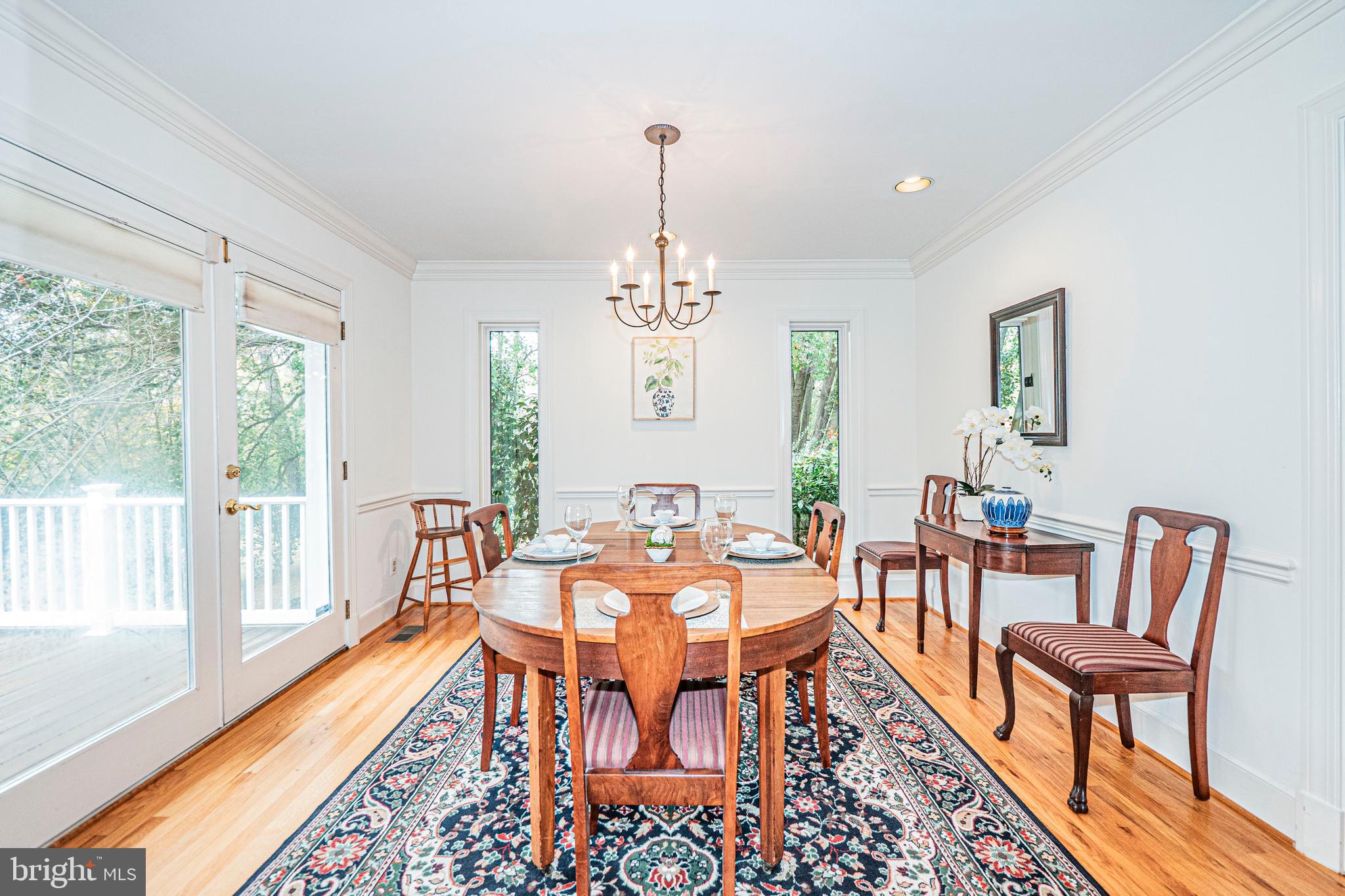 10100 Watkins Road Gaithersburg, MD 20882 - Photo 21 of 113 a view of a dining room with furniture window and wooden floor