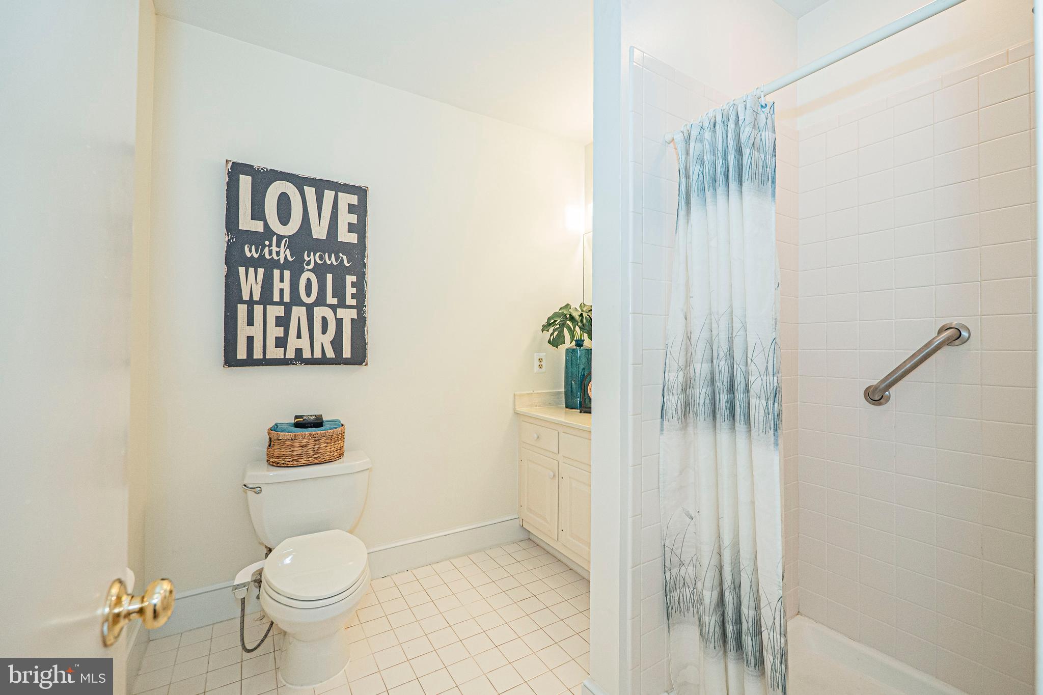 10100 Watkins Road Gaithersburg, MD 20882 - Photo 32 of 113 a white toilet sitting next to a bathroom sink