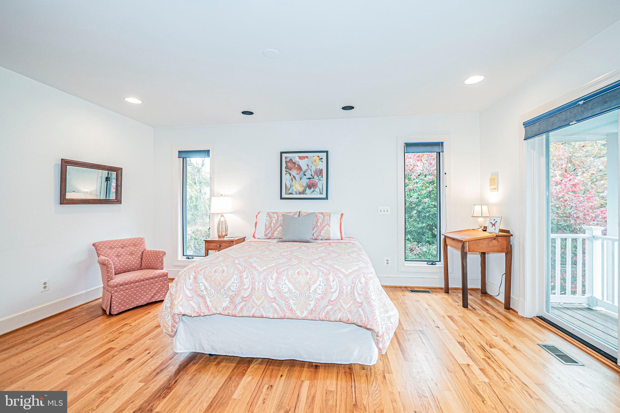 10100 Watkins Road Gaithersburg, MD 20882 - Photo 34 of 113 a spacious bedroom with a bed and a wooden floor