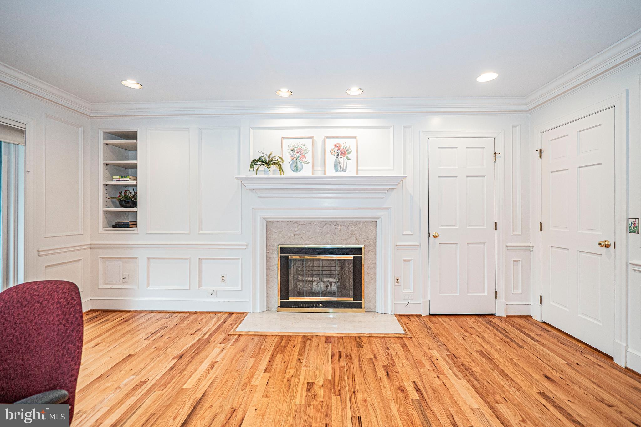 10100 Watkins Road Gaithersburg, MD 20882 - Photo 50 of 113 a view of an empty room with wooden floor fireplace and a window