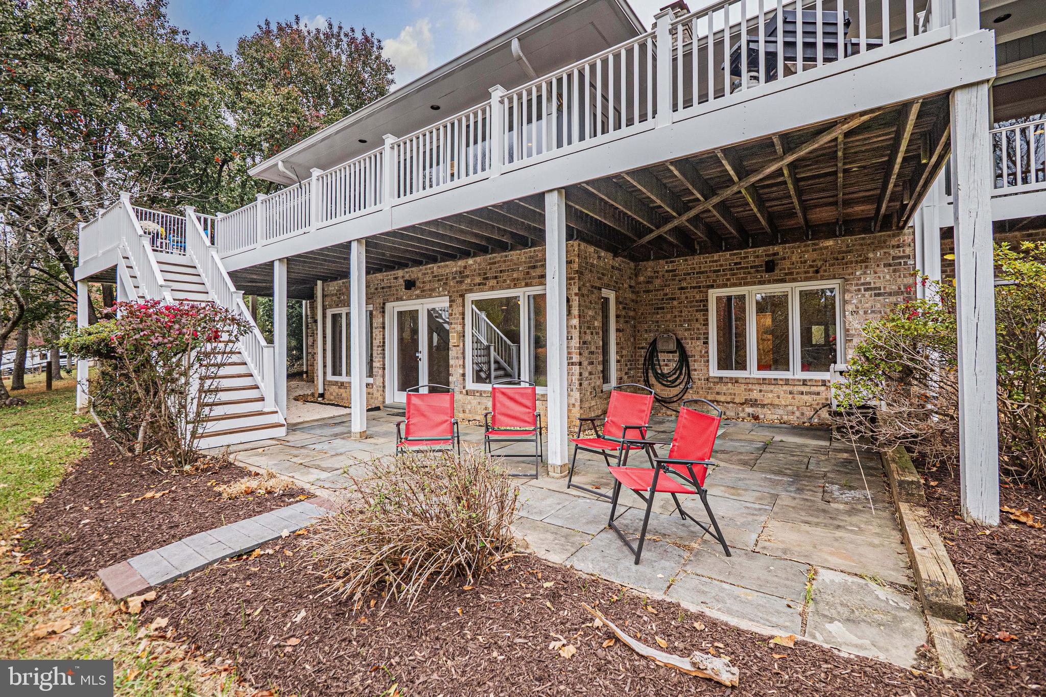 10100 Watkins Road Gaithersburg, MD 20882 - Photo 86 of 113 a view of a patio with a table and chairs and potted plants