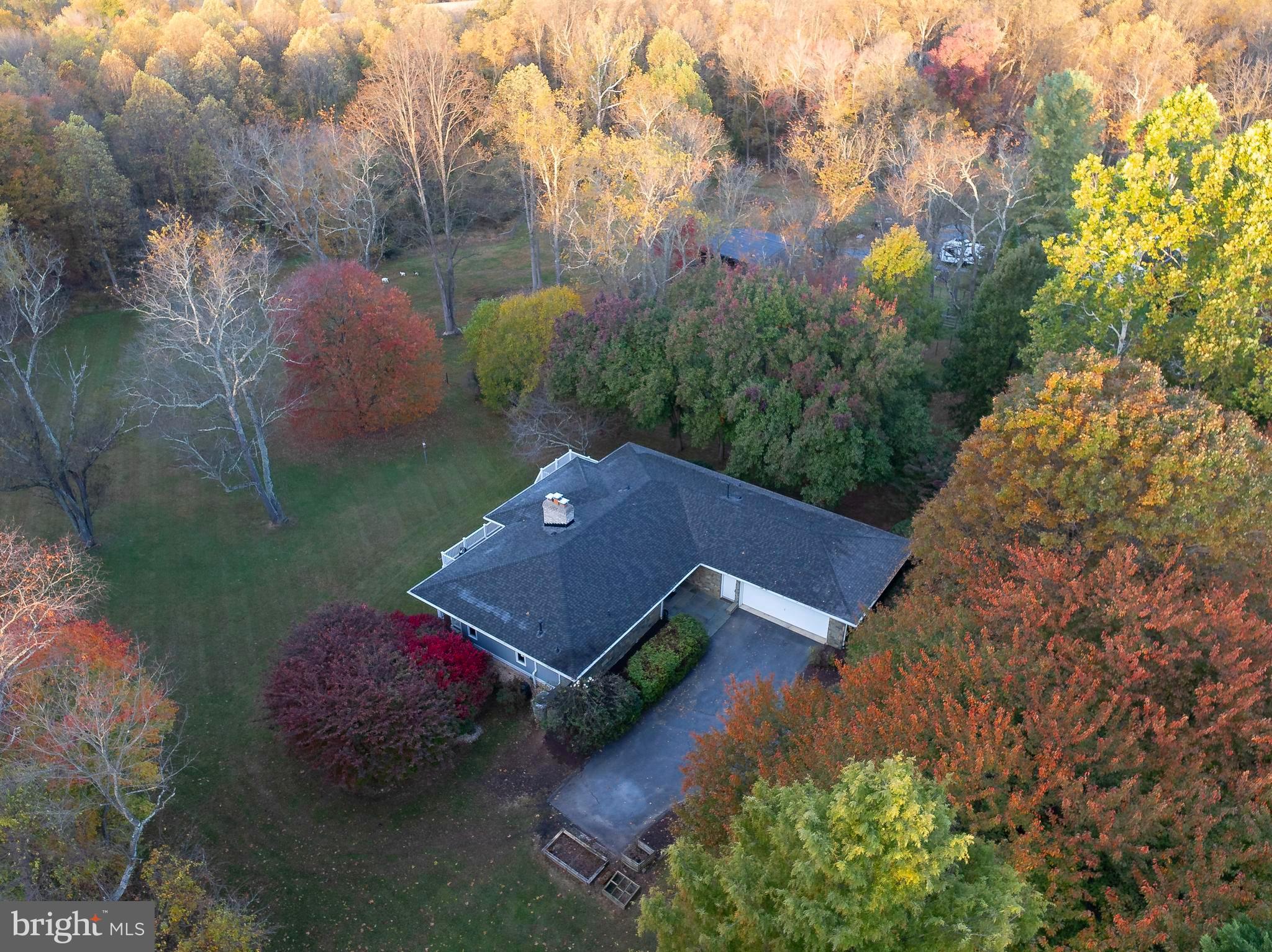 10100 Watkins Road Gaithersburg, MD 20882 - Photo 99 of 113 an aerial view of a house with garden space and street view