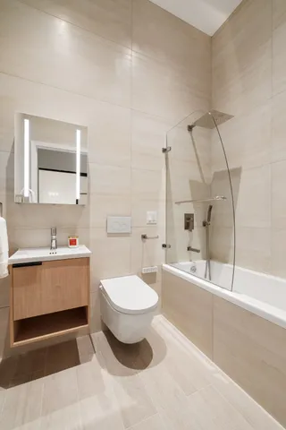 a bathroom with a sink a toilet and a bathtub
