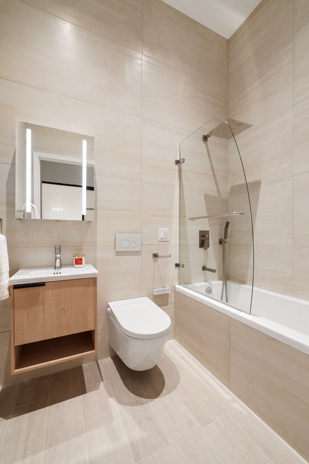 Undisclosed Address Manhattan, NY 10012 - Photo 10 of 12 a bathroom with a sink a toilet and a bathtub